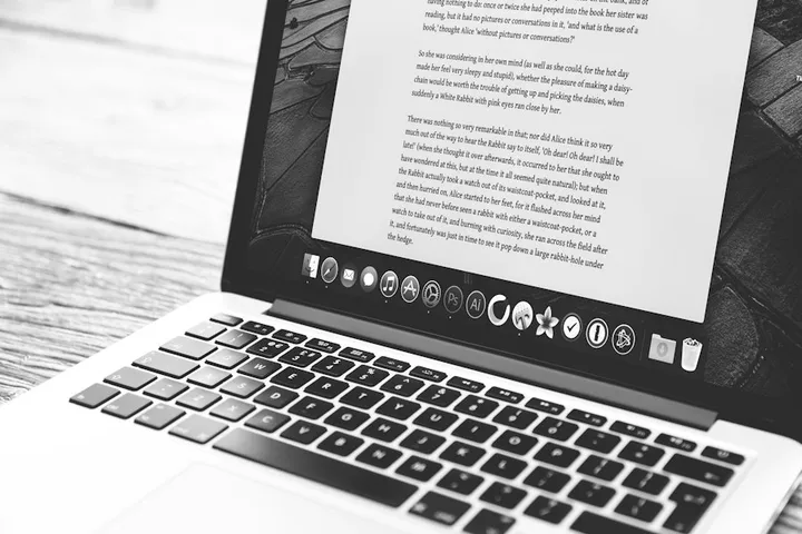 Laptop showing a text document, the craft of writing for machines